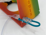 Closeup of auto-primer on a Rainbow Tubie Tower in use with MOOG bag Cassette