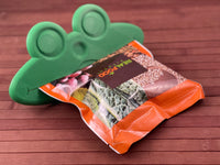 Froggy Feeder squeezing Real Food Blends Pouch from bottom