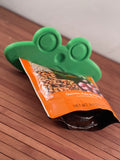 Froggy Feeder squeezing Real Food Blends Pouch from top